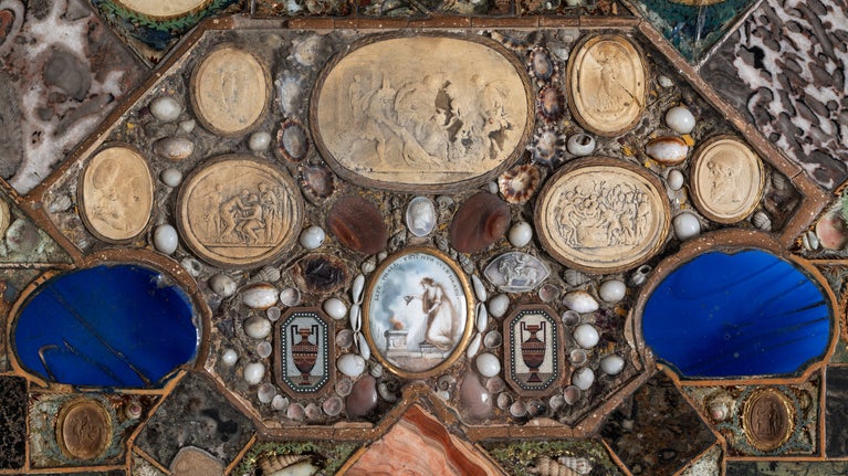 Detail of the interior of a painted and decorated octagonal work table at A la Ronde, Devon.